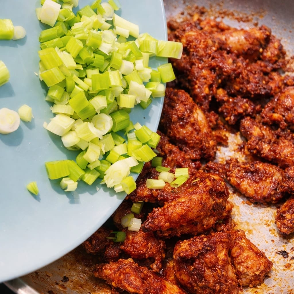 Adding Fresh Spring Onions to Fried Chicken Wings