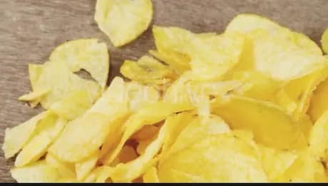 Cheese and onion chips spread on a plate
