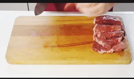 Raw beef cut into small pieces for frying