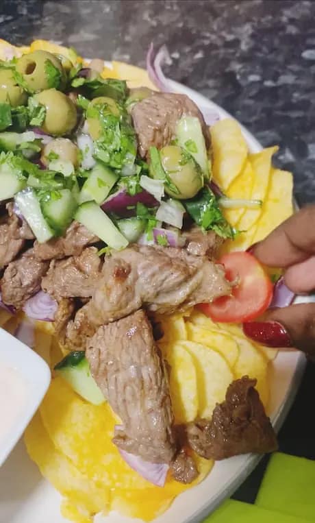 Cherry tomatoes and jalapeños added to beef plate