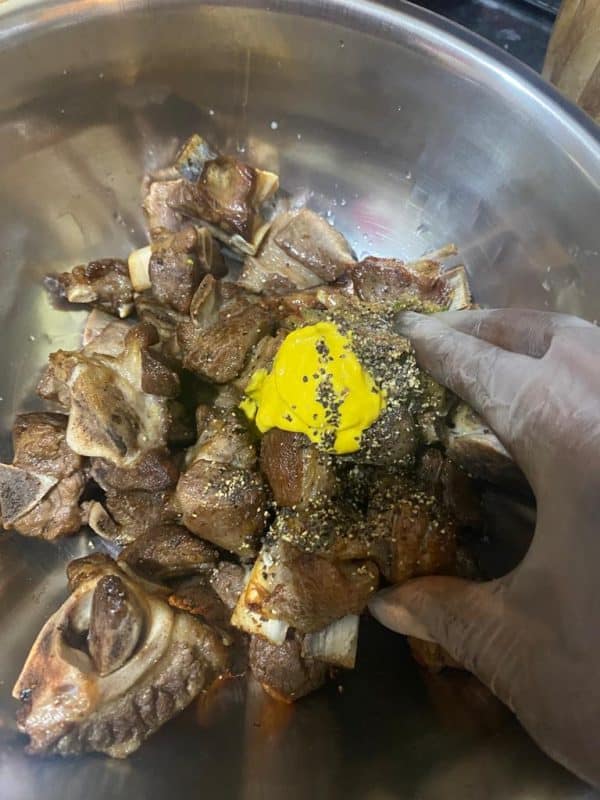 Mouth-watering grilled lamb Meat pieces coated with mustard, black pepper, and seasoning paste.