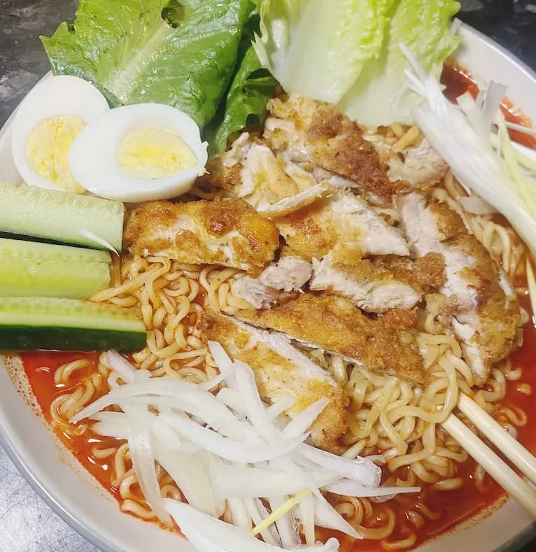 “Colorful African home-cooked meal served in a vibrant kitchen style – from Cook with Tima