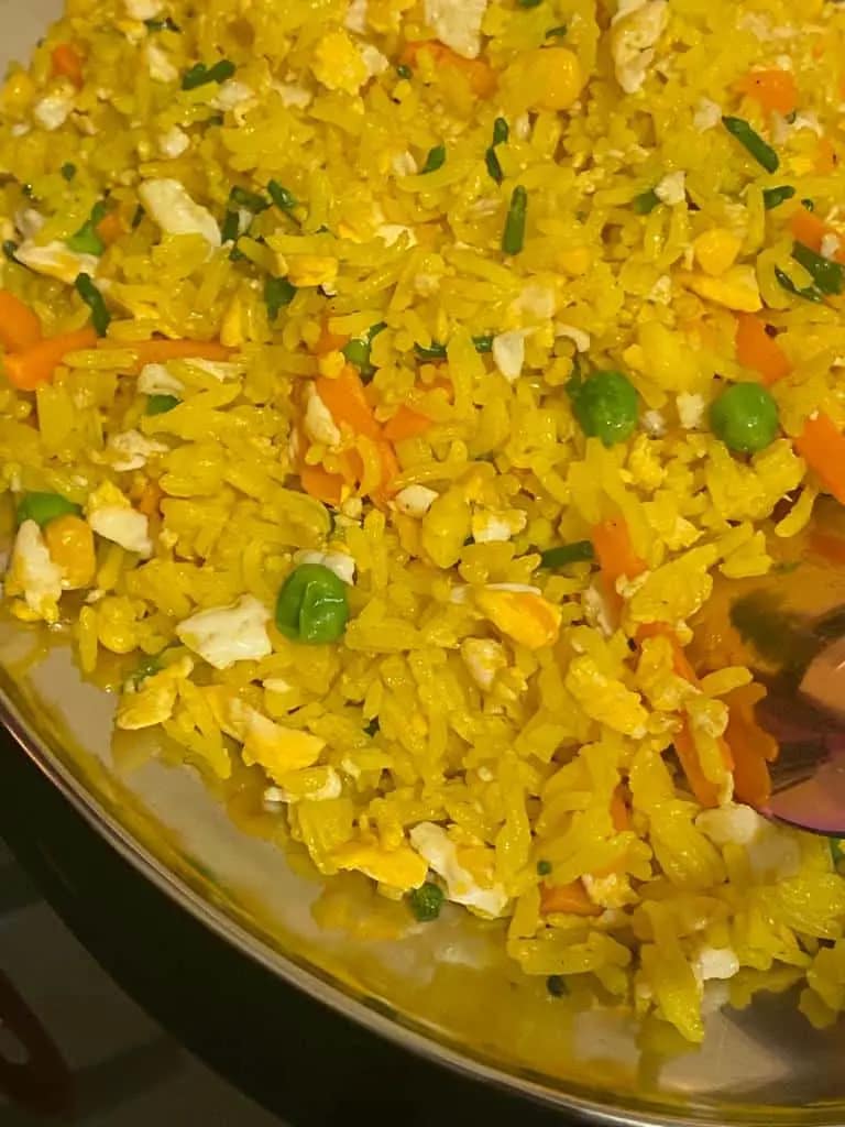 Golden turmeric fried rice with vegetables and scrambled eggs