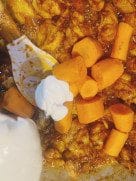 Adding yogurt to curry base and simmering with chicken wings